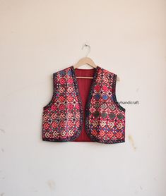 HARMONYHANDICRAFTCO presenting beautiful vintage banjara vest, It's reversible jacket which means you can wear this by both side.  Buy it for the holidays! Looks fabulous over a long silk tank dress or palazzo pants. Or wear it with jeans and boots. The design of the jacket is very unique and very rare. Indian culture and associated with grace and beauty. This Is A Gorgeous Piece Of Cotton Kantha Stitched jacket. Perfect Gifts For Your Beloved.. What Are You Waiting For? Add This Item To Cart, Buy Now And Surprise Your Loved Ones! Measurements Approx : L/XL Length - 18 Inches Chest - 42 Inches Shoulder - 16 Inches Fabric - 100% Cotton Banjara vest, banjara sleeveless jacket, quilted vest, quilted jacket,embroidery vest, Indian kantha jacket, Kantha waistcoat, Reversible kantha jacket boho Bohemian Sleeveless Embroidered Outerwear, Festive Bohemian Vest With Floral Embroidery, Traditional Sleeveless Cotton Outerwear, Festive Bohemian Sleeveless Vest, Festive Bohemian Vest, Multicolor Bohemian Vest For Festive Occasions, Bohemian Multicolor Festive Vest, Traditional Sleeveless Vest Outerwear, Folk Style Sleeveless Vest For Festive Occasions