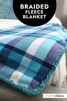 a blue and white plaid blanket with the words braided fleece blanket on it