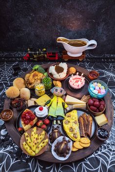 a table topped with lots of different types of food