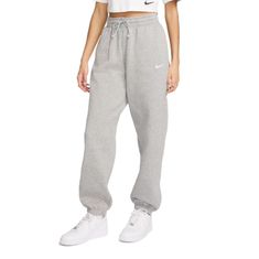 Nike Women's Sportswear Phoenix Fleece High-Waisted Oversized Sweatpants Color: Dk Heather Grey Grounded In Style, Comfort And Versatility, Meet Nike's Take On Luxury Loungewear. Whether You're Running Errands Or Rewatching Your Favorite Show, These Midweight Fleece Sweats Feel Extra Soft On The Inside To Help Keep You Cozy. The Oversized Fit Is Intended To Sit High On Your Hips For Comfort And A Stay-Put Feel. Fit & Design: Oversized Fit: Exaggerated And Spacious Full Length: Hits Below Ankle Encased Elastic Waistband And Drawstrings Ensure A Fit That Feels Just Right Pockets Provide Quick Storage For Keys, Phone And Cold Hands Embroidered Swoosh Logo On Left Leg Nike Relaxed Fit Joggers, Nike Relaxed Fit Bottoms With Ribbed Waistband, Cotton Athleisure Sweats, Nike Sweatpants For Fall, Cotton Sporty Sweatpants, Nike Sports Bottoms For Winter, Nike Sportswear Bottoms For Leisure, Sweats With Pockets For Sports, Winter Activewear Long Pants