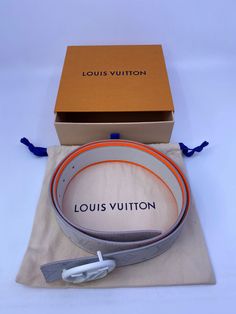 This reversible Louis Vuitton belt is composed of Antarctica White Monogram Canvas and leather and features a neon orange leather trim and a white circled LV initials belt buckle. Model: M0169S Color: White & Orange Material: Antarctica White Monogram Canvas & Leather Made in: Spain Size: 38" / 95 cm, Width: 40 mm Condition: NEW with dust bag & box. Size: 40" / 100 cm, Width: 40 mm Condition: NEW with dust bag & box. Circle Belt, Orange Material, Louis Vuitton Belt, Louis Vuitton Men Shoes, Louis Vuitton Men, Orange Leather, Neon Orange, Canvas Leather, Shoe Box