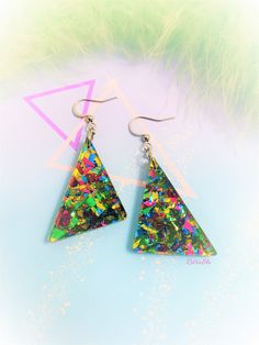 "Choice of sterling silver .925 or surgical stainless steel Approximately 1.25\" wide, and 2.5\" long from top of metal hook Rad chunky colorful glitter earrings! Inspiration straight from the 80s, redesigned for the new retro look. These earrings are sure to sparkle, and packed full of color! Glitter placement will vary for each pair of earrings, making them unique to you! Check this link for mini versions! https://www.etsy.com/listing/1417772192/mini-80s-inspired-chunky-glitter This product is Silver Rave Jewelry For Party, Silver Rave Jewelry For Gift, 90s Vaporwave, Colorful Glitter, Earrings Making, Vaporwave Aesthetic, Glitter Earrings, New Retro, Earrings Geometric