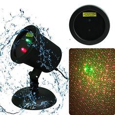 a green and red light is on top of a black object with water splashing around it