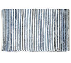 a blue and white striped rug on a white background, with horizontal stripes in the middle