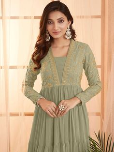 This elegant Green Sequins and Embroidered Tiered Maxi Dress features a floral embroidered design, fit and flare shape, and a flattering V-neckline. Its long regular sleeves and flared hem add a touch of sophistication, while the slip-on closure allows for easy dressing. Perfect for any formal occasion, this dress is a