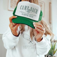 Get ready for the ultimate camp bachelorette experience with our personalized trucker hat, designed exclusively for the bride-to-be and her bridal party. These custom bachelorette hats are the perfect accessory for your camping-themed bachelorette party, ensuring your crew stands out around the campfire. Each hat is carefully crafted to be both stylish and functional, making it an ideal keepsake long after the celebration is over. Whether you're planning a camp wedding or a bachelorette weekend, Bachelor Party Hats, Lake Bachelorette, Cowgirl Hats Western, Bridal Party Hats, Camp Bach, Camping Bachelorette, Bachelorette Hats, Patriotic Hats, Hats Summer