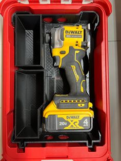 a tool box filled with tools like drill and screwdriver in it's storage compartment