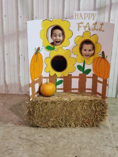 a child's photo frame with hay and pumpkins