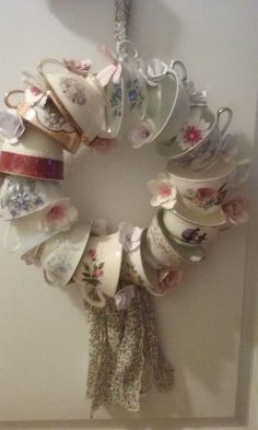 a wreath made out of tea cups and saucers