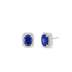 Elevate your day or nighttime looks with these alluring lab-created sapphire and diamond stud earrings. 10K white gold Each earring features an 8.0 x 6.0mm oval-shaped blue lab-created sapphire Diamonds line the open octagonal frame 1/6 ct. t.w. of diamonds Friction backs Formal Diamond Birthstone Earrings, Formal Jewelry With Halo Design And Lab-created Sapphire, Sapphire Jewelry With Pave Setting Gift, Lab-created Sapphire Jewelry With Halo Design, Sapphire Jewelry With Pave Setting, Sapphire Cubic Zirconia Jewelry With Pave Setting, Sapphire Pave Setting Jewelry, Classic Blue Oval Diamond Earrings, White Gold Jewelry With Pave Setting And Lab-created Sapphire