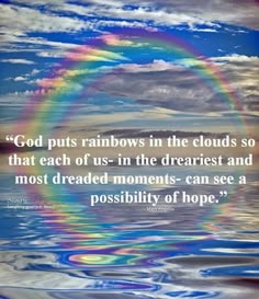 a rainbow in the sky over water with a quote about god puts rainbows in the clouds so that each of us