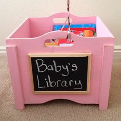 a baby's library bin with chalkboard attached to it