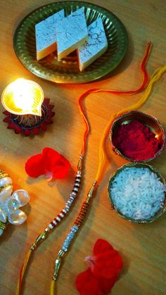 the diwals are arranged on the table with candles and other things to decorate