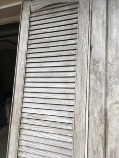 an old wooden door with slats on it