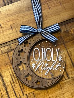 a metal ornament with the words holly night on it