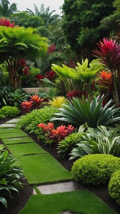 a garden with lots of green grass and flowers