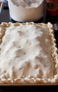 an uncooked pie sitting on top of a counter