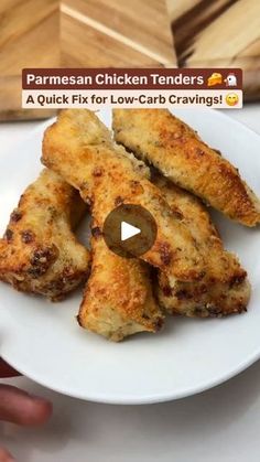 chicken tenders on a white plate with a person holding it in their hand and the text, parmesan chicken tenders a quick fix for low - carb carving