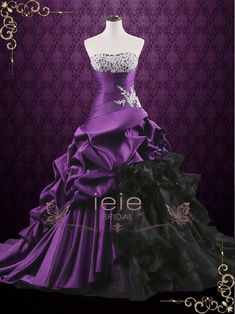 a purple and black wedding dress on display