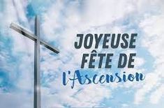 a cross with the words joyeuse fete de l'ascension on it