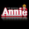 the musical annie logo on a black background