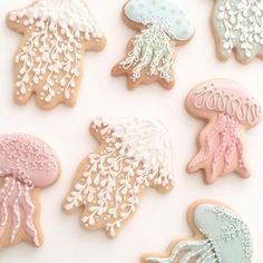 decorated cookies with jelly fish, seaweed and jellyfish on white tablecloths