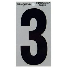 a white and black number three sticker