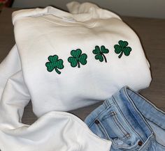 Perfect for St. Patrick's Day These sweatshirts are sooo soft and cozy! Order yours in a white or grey sweatshirt with the green shamrocks - or - in a green crewneck with white embroidery! :)  Note: All of my embroidery designs are well made + machine washable! The sizing is unisex adult sizing. Please message me if you have any questions! Green Crewneck, Funny Sweaters, Women Sweatshirt, Sweatshirt For Women, Hoodie Size Chart, Sweatshirt For Men, Embroidered Sweatshirt, White Embroidery, Print Sweatshirt