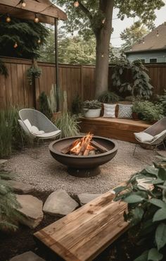 an outdoor fire pit with chairs around it