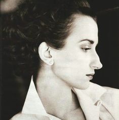 a black and white photo of a woman with her eyes closed