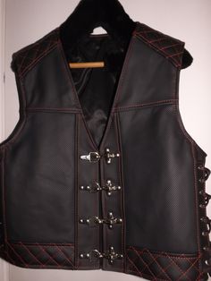 MATERIAL: GENUINE LEATHER  Two inside pockets. Biker vest. Patch vest. Perforated leather-1,8mm. Impregnated leather(dark gray). Made by designer and leather tailor with experience of 30 years. There can be produced in any size and model take 5-10 days. Order can be any size from M to 6X. The leather can be selected by color, thickness up to 2 mm. How to remove size: chest width = cm or inch? waist width = cm or inch? length back = cm or inch? If any questions, please feel free to ask! Gothic Black Leather Biker Jacket, Sleeveless Black Biker Jacket For Biker Events, Black Leather Moto Vest, Black Fitted Moto Vest, Black Fitted Biker Vest, Black Leather Motorcycle Vest, Black Leather Vest For Motorcycling, Fitted Leather Vest For Outdoor, Fitted Black Leather Vest