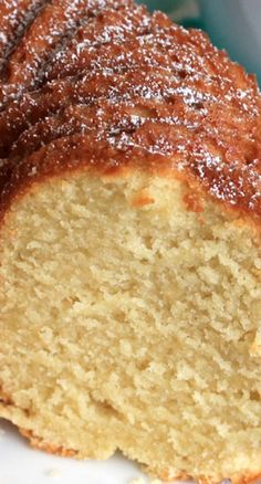 a close up of a cake on a plate with powdered sugar and icing