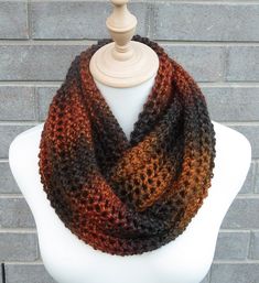 This beautiful hand knitted infinity scarf is made with self-striping 100% Acrylic Yarn. This pattern looks the same on both sides. It can be worn loose or wrapped around once.  Very beautiful colors: shades of burnt orange, brown, and brick red. The colors may appear slightly different on different monitors. Measures: 51" (130 cm) long x 11" (28 cm) wide. From a smoke-free home. Care instructions: Hand wash in cool water and dry flat. Red Infinity, Chunky Knit Scarf, Scarf Chunky, Chunky Knit Scarves, Colors Shades, Knit Infinity Scarf, Brick Red, Orange Brown, Knit Scarf