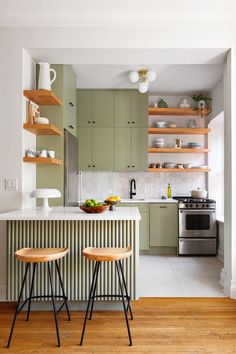 two stools are in front of the kitchen island