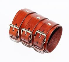 Unique brown leather bracelet! Very comfortable & easy to wear. Size: Wirst size: 6-8.5 inches(16-22cm) Width: 3.5 inches (9 cm) Color: brown. Material: genuine leather(leather is produced in Italy). If you have any questions please write! Brown Punk Leather Bracelet For Gift, Punk Style Cuff Bracelet As Gift, Punk Leather Cuff Wristband, Punk Leather Cuff Bracelet With Wrist Strap, Leather Punk Cuff Bracelet With Wrist Strap, Adjustable Brown Punk Bracelets, Rugged Adjustable Cuff Leather Bracelet, Punk Leather Wristband, Punk Style Leather Wristband As Gift