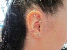 a woman with ear piercings on her ears