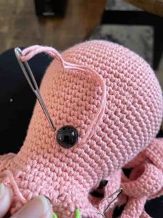 someone is knitting an octopus stuffed animal