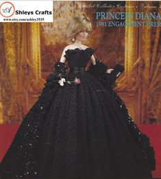 a barbie doll wearing a black dress with flowers on it's chest and sleeves