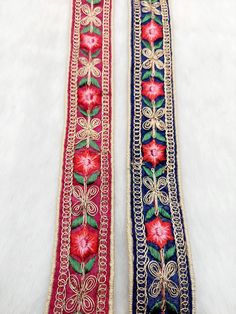 two red and blue ribbons with flowers on them