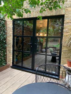 an outdoor patio area with tables and chairs