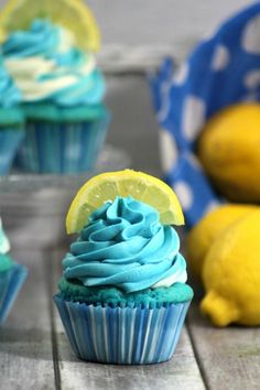 cupcakes with blue frosting and lemon slices