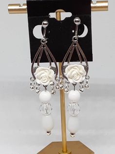 They are long statement Earrings. Made with silver tone materials.  Be sure to check out my other items too  I have amazing deals in my CLEARANCE EARRINGS section!! Check them out. Long Chandelier, Earrings Everyday, Prom Wedding, Clip On, Statement Earrings, Clip On Earrings, Wedding Gifts, Silver Tone, Jewelry Earrings