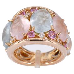 This exquisite rose gold ring by Crivelli is a captivating piece adorned with a brilliant array of gemstones. The 0.24-carat diamonds, cut to perfection in brilliant style, showcase a stunning D-E color and VVS clarity, ensuring a mesmerizing sparkle. The focal point of the ring is the baroque gemstones, featuring a delightful mix of pink and blue hues totaling 12.62 carats, complemented by a 0.67-carat sapphire. The ring, weighing 17.8 grams, is crafted from 18K rose gold 750, adding a warm and