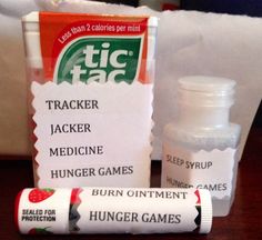 a table topped with two bottles of medicine next to a sign that says tracker jacker