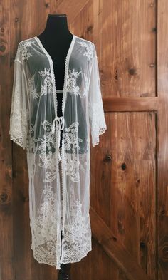 "An overlayering piece made with soft embroidered sheer lace. Makes for a super sweet cover up for any outfit! ONE SIZE FITS MOST - SMALL, MEDIUM, LARGE, XL Length: 46\" Bust: 24\" flat measure (tie front, one size fits all) Armhole: 14\" Get two items or more and your shipping is on us! Enter code FREESHIP at checkout! (US shipping only)" White Lace Jacket, Lace Duster, Cardigan Fits, Kimono Boho, Sheer Kimono, West Covina, Cardigan White, Dont Look Back, Lace Kimono