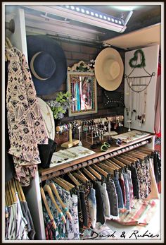 a room filled with lots of clothes and hats