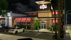 a night time view of a fast food restaurant with cars parked in the parking lot