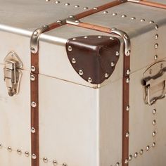 an old trunk with rivets and leather straps