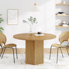 a wooden table with two chairs and a vase on it in front of a white wall