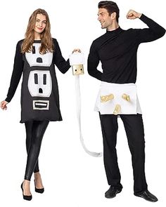 a man and woman dressed in costumes standing next to each other with an electrical outlet attached to their body